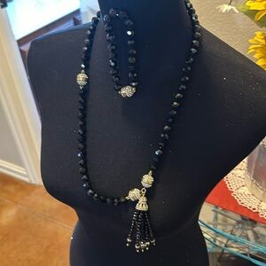 Necklace and bracelet set. The black facets shine but you can’t tell in the pic